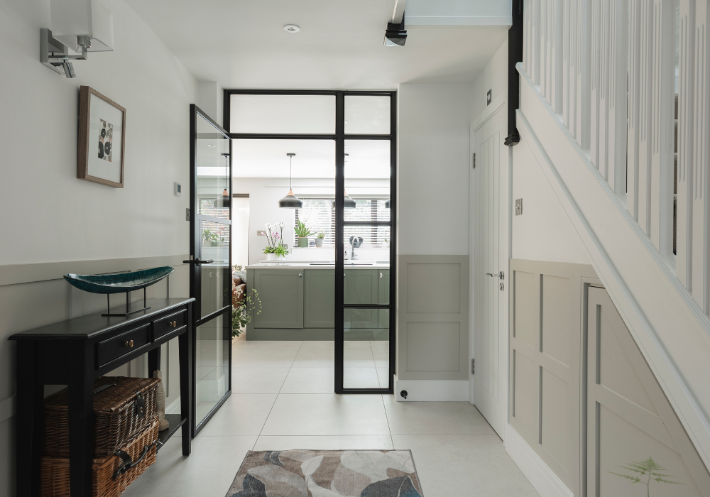 Full-width rear extension with large sliding doors in Englefield Green